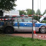 Polizeiauto angezündet